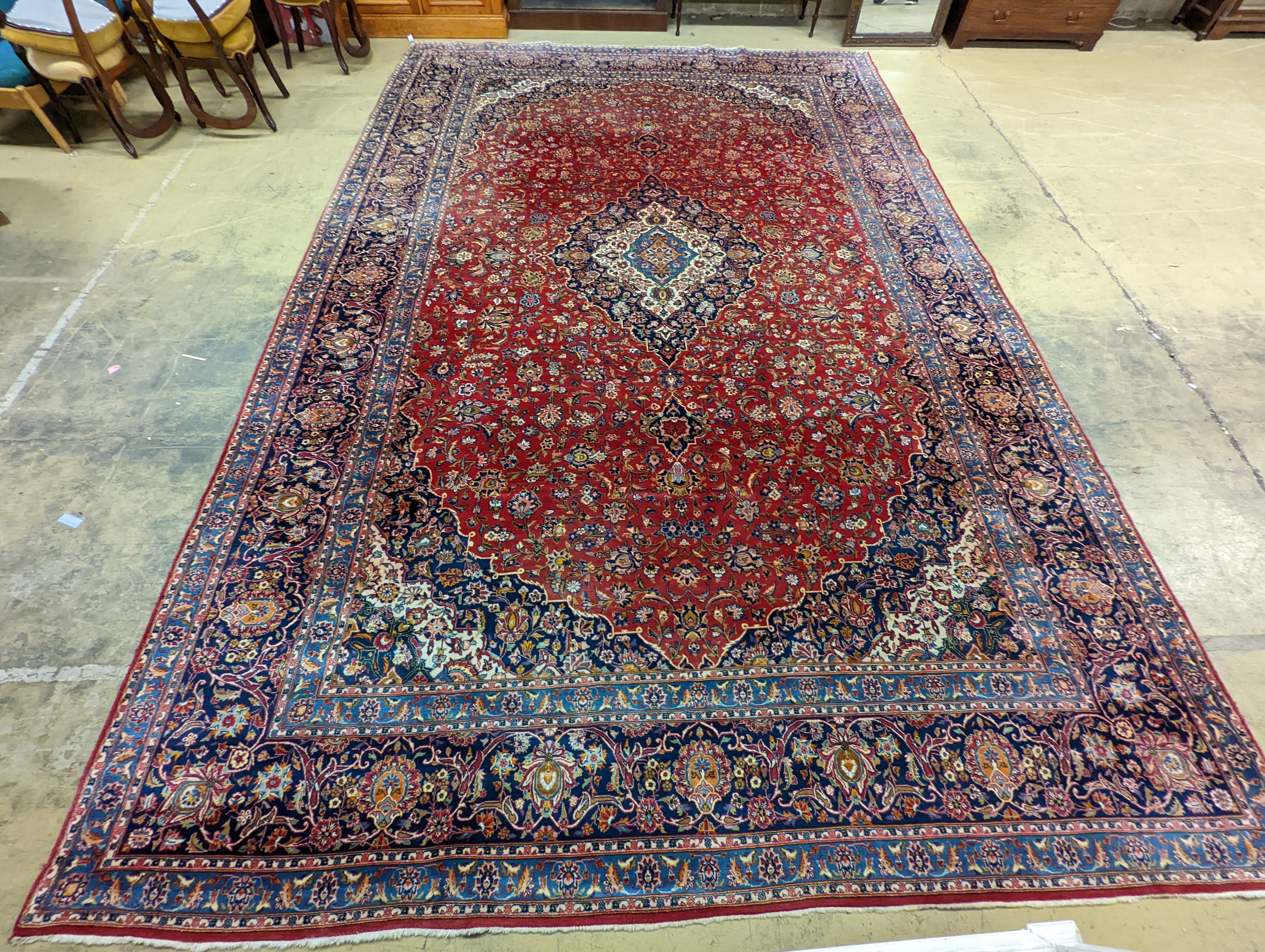A large Tabriz red ground floral carpet, 540 x 350cm
